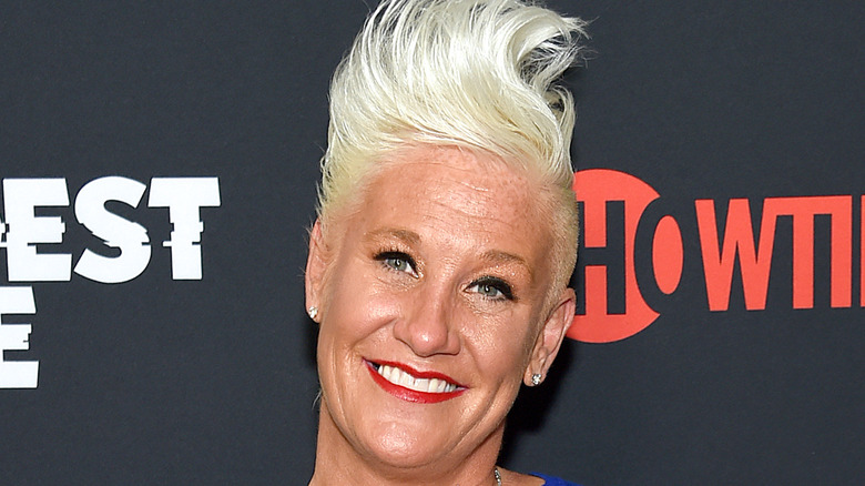 Anne Burrell smiling at an event