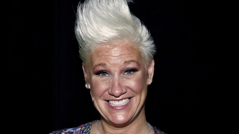 Anne Burrell smiling at an event