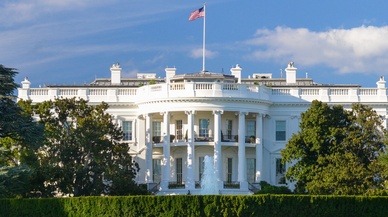 The White House displaying the American flag