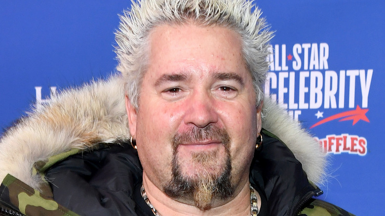 Guy Fieri wearing a camo jacket