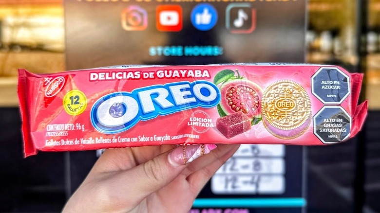 hand holding box of guava Oreos