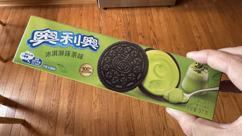 hand holding box of matcha Oreos