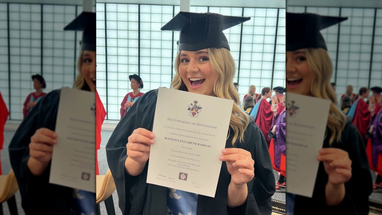 Tilly Ramsay smiling while posing with her diploma
