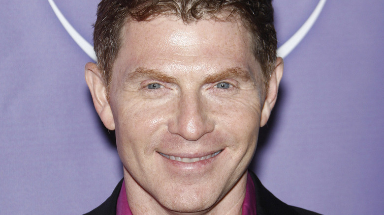 Bobby Flay smiling at event  