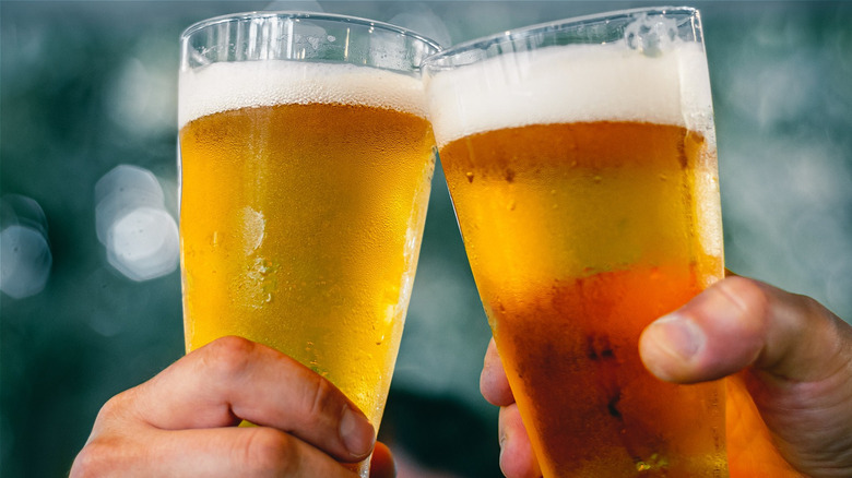 People holding glasses of beer 