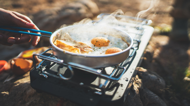 Cooking eggs with a camp stove