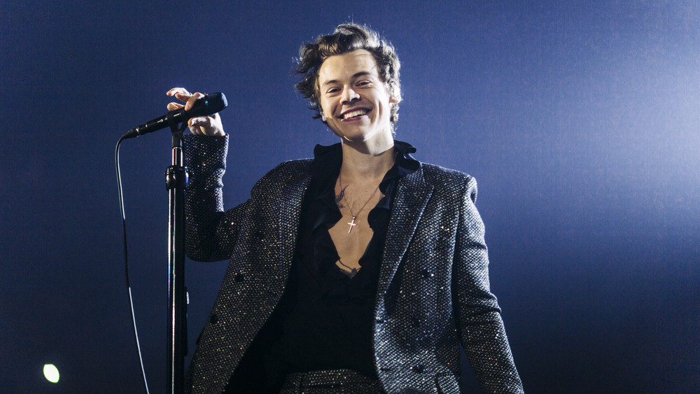 Harry Styles performing on stage