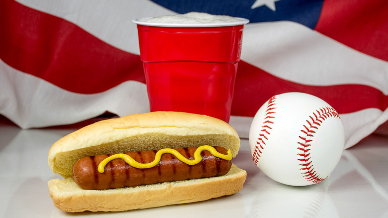 Hot dog, drink, and baseball