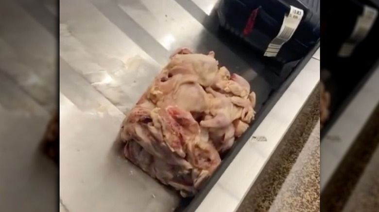 Cube of chicken on baggage carousel