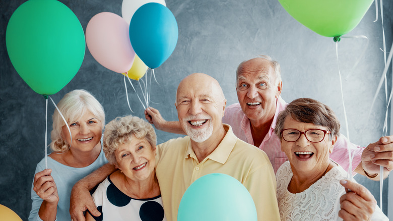 Elderly people with baloons