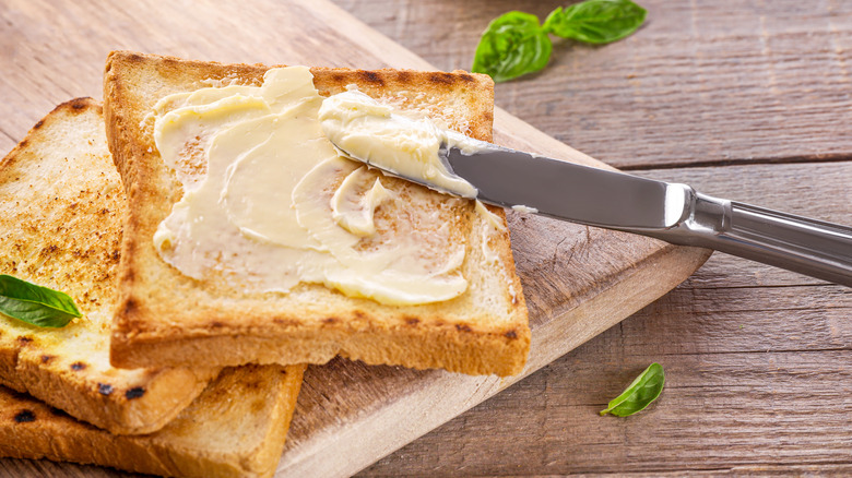 Butter with knife on toast