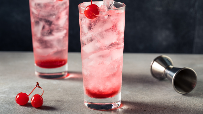 Shirley Temple in a glass with ice and a cherry