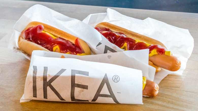 IKEA hot dogs in paper packaging with mustard and ketchup