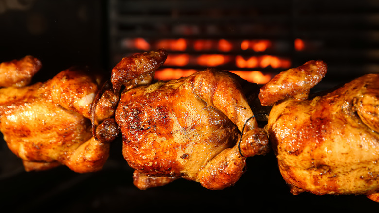 Rotisserie chickens roasting
