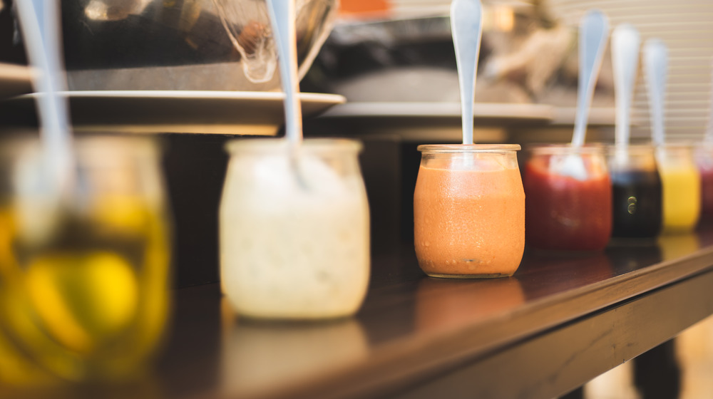 Assorted dressings in jars