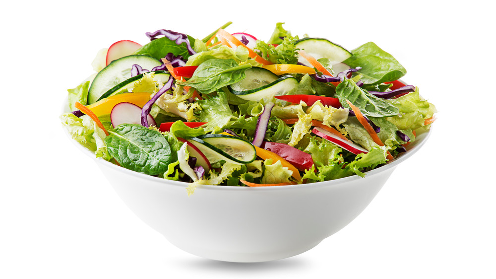 White bowl with green salad