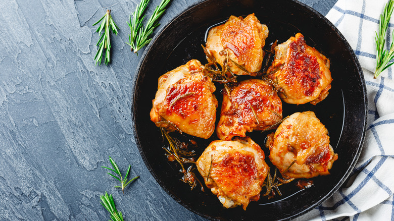 crispy chicken thighs in pan