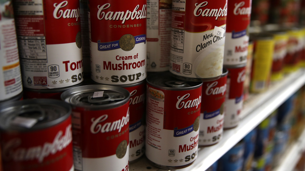 Line of Campbell's soup cans in store  