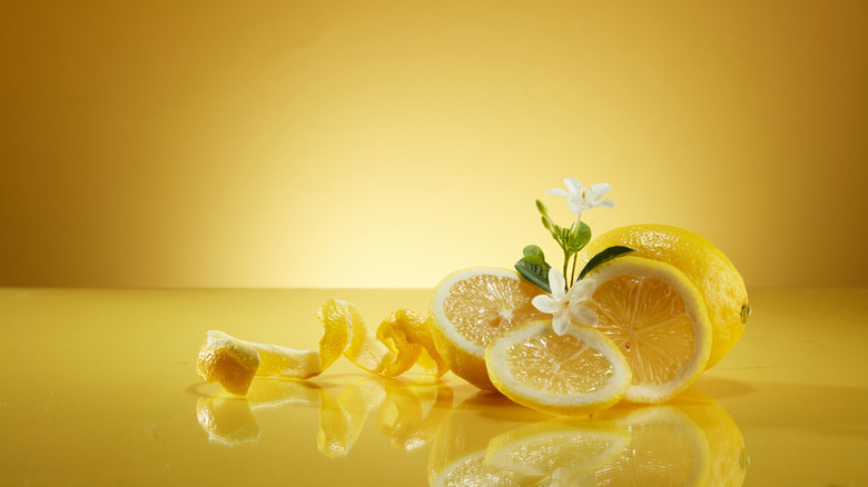 Peeled lemon on a yellow background