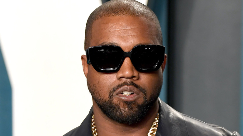 Kanye West with sunglasses and gold chain