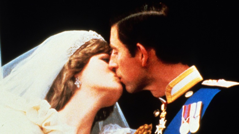 Prince Charles and Princess Diana kiss at their wedding