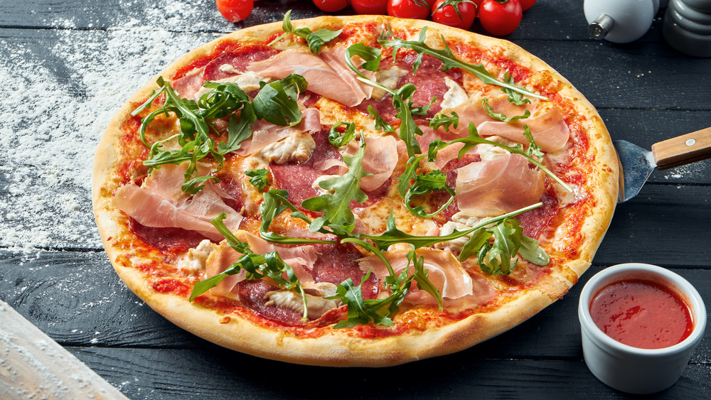 pizza with salami, prosciutto and chicken