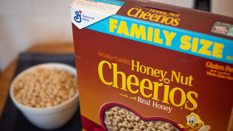 Box of Honey Nut Cheerios next to bowl