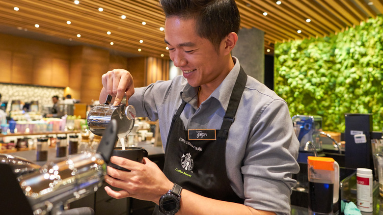 Starbucks barista making a beverage