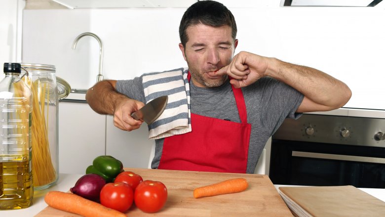 man with kitchen knife injury