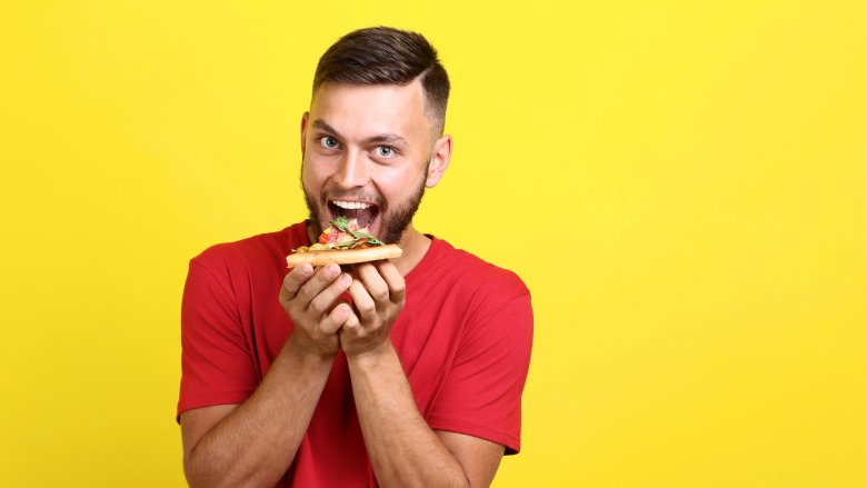 Man eating pizza