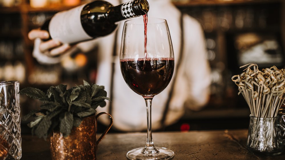 Bartender pouring wine