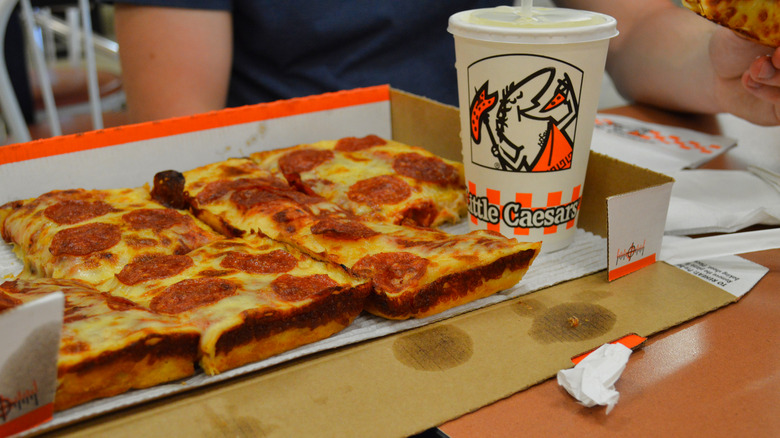 Little Caesars pizza and drink in a box