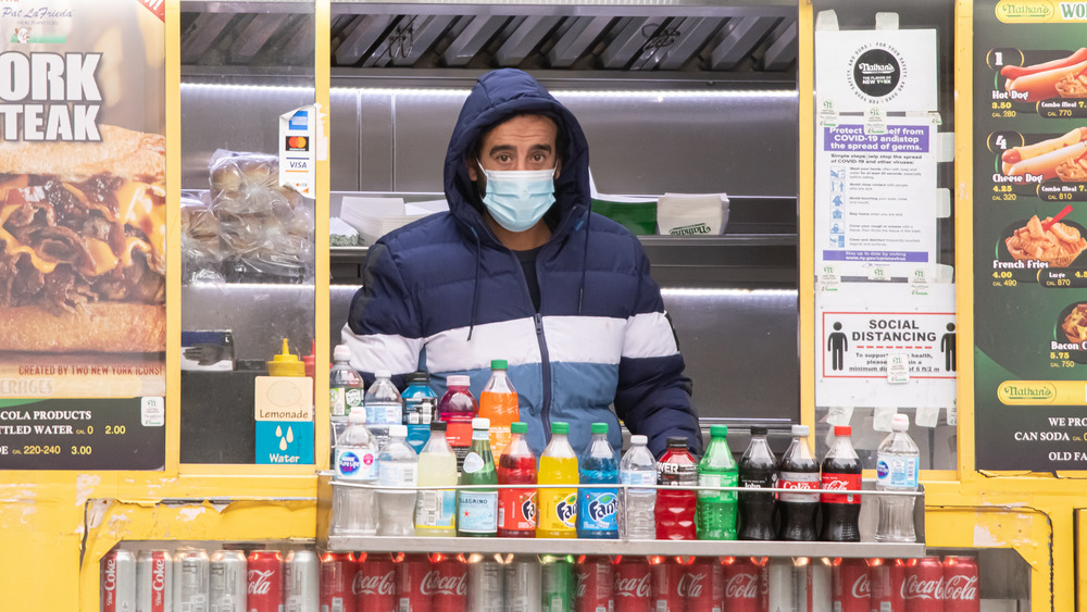 Food truck with masked worker