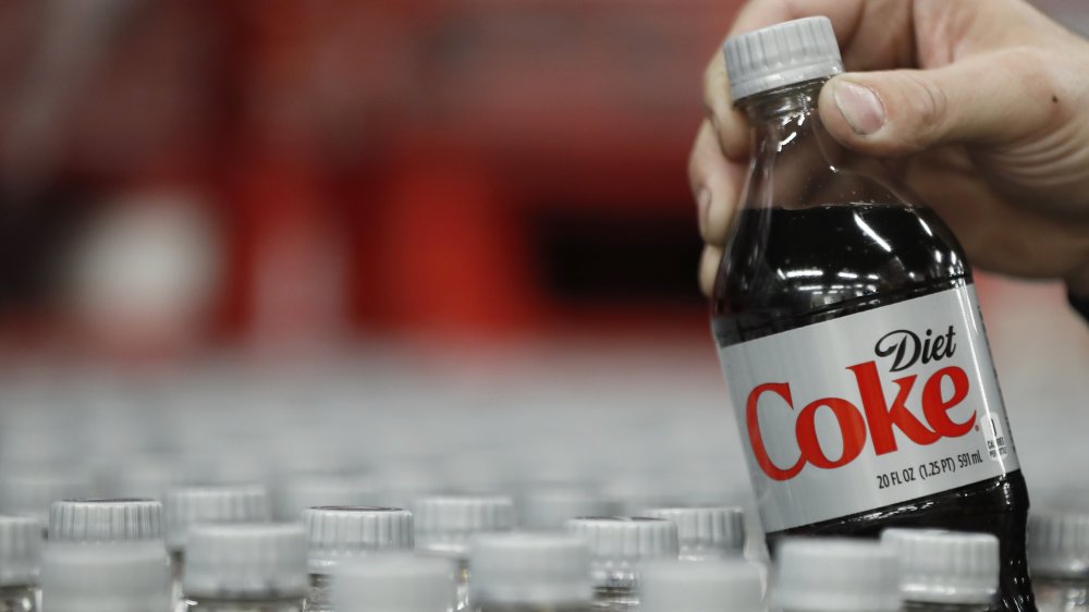 Diet Coke being pulled out of a display