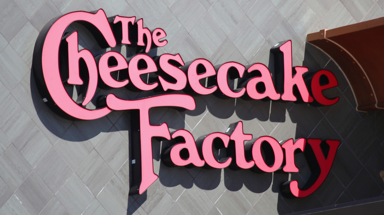 Red Cheesecake Factory logo on building