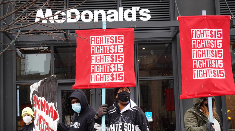 Protesters standing outside McDonald's