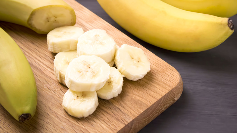 Banana slices and whole bananas