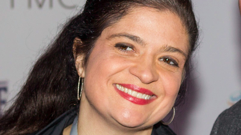 Close up of Alex Guarnaschelli smiling and wearing earrings