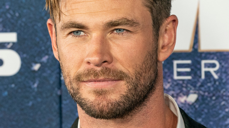 Chris Hemsworth looking to the side with slight smile