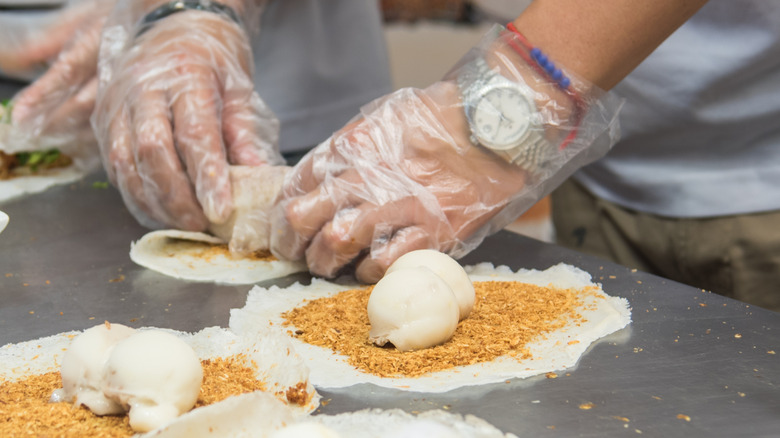 shaving peanut brittle for taiwanese ice cream rolls