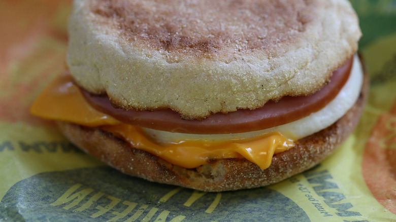 Close-up of McDonald's egg McMuffin on paper wrapper.