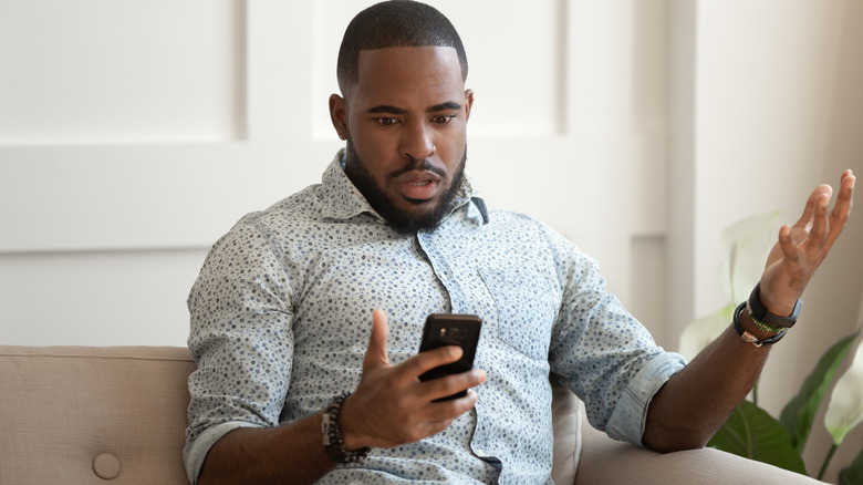 man holding phone