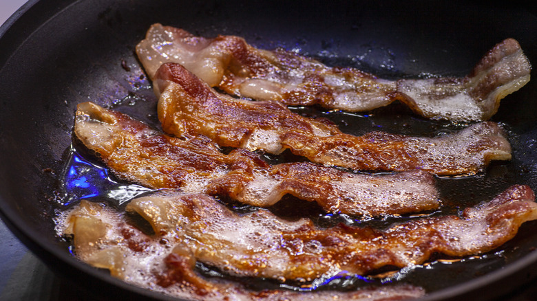 bacon frying in a pan