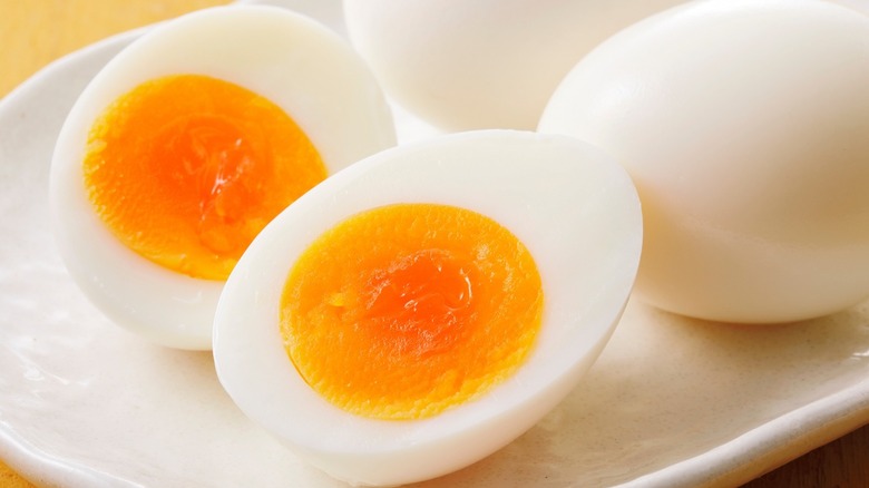 Sliced and whole sof- boiled eggs