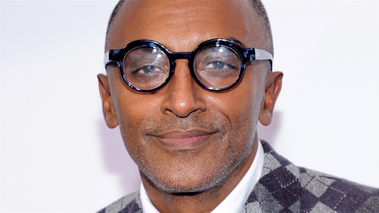 Marcus Samuelsson wearing glasses with slight smirk