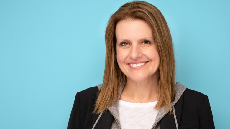 Erin Newkirk on blue background