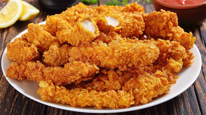 Battered and breaded fried chicken on a plate