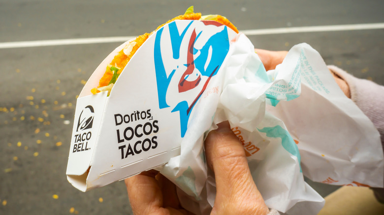 hands holding Doritos Locos Taco