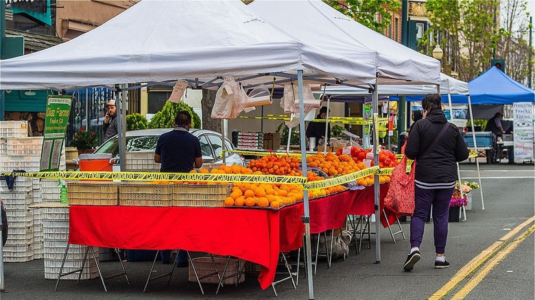 woman selling fruit outdoors
