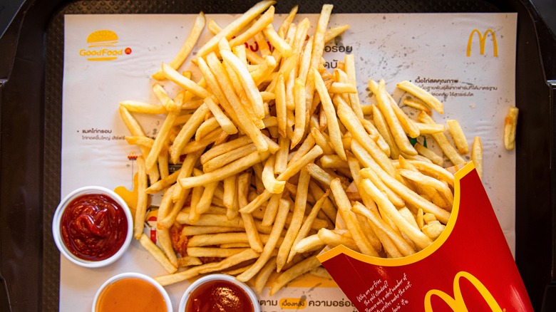 McDonald's french fries on tray with ketchup
